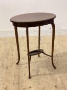 An Edwardian mahogany oval occasional table, raised on cabriole supports united by under tier H70cm,
