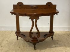 A Victorian oak serpentine hall table moving on castors, H93cm