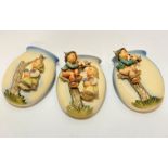 A group of three Hummel pottery figure oval wall pockets with Apple Tree boy and girl figures, (15.