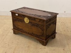 An eastern carved camphor wood blanket box with sliding tray to interior, H48cm, W80cm, D40cm