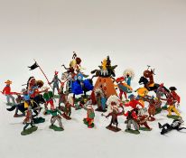 A collection of Britain's plastic cowboys, Native American figures, knights, totem pole, teepee,