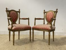 A pair of Regency style gilt elbow chairs, with turned and fluted uprights, arm terminals and