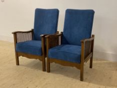 A pair of 1930s upholstered beech and cane reclining chairs, H88cm, W55cm, D53cm