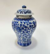 A modern blue and white baluster vase decorated with chrysanthemum and leaf design with lotus border