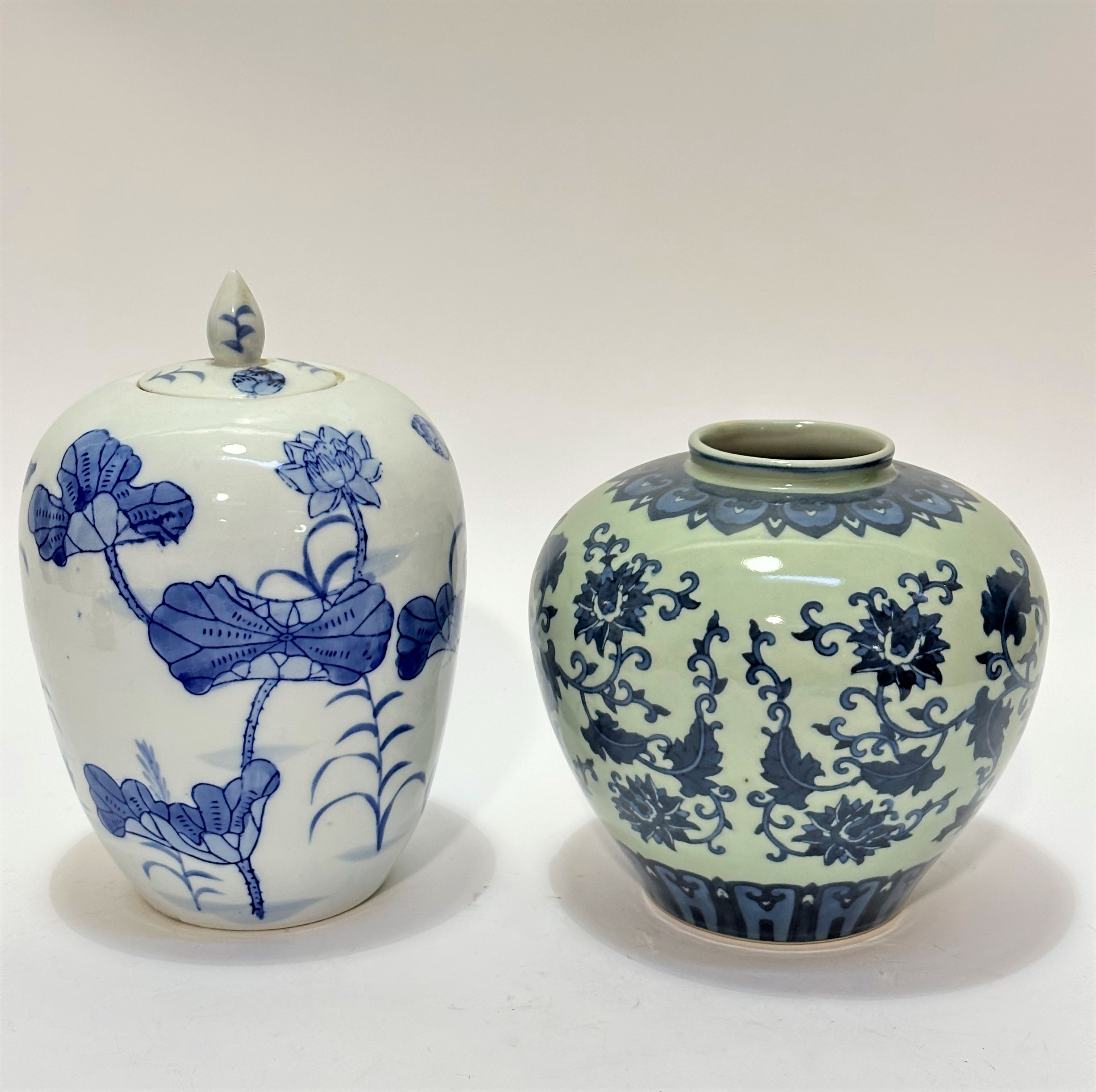 A modern Chinese blue and white ovoid ginger jar with water lily design complete with cover and