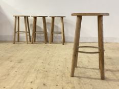 A set of six contemporary ash stools, the circular seats raised on turned supports united by a