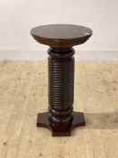A stained mahogany pedestal plant stand, the circular top raised on a spiral turned column H71cm