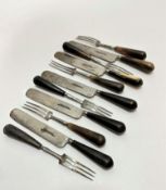 A set of six 19thc horn handled hand forged steel three pronged forks and a set of five knives