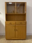 Ercol, A blonde elm side cabinet, the super structure with two glass doors, two drawers and cupboard