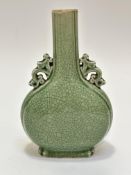 A Chinese craquelure pear shaped bottle style vase with archaic style mythical beast handles to side