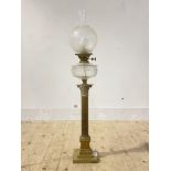 An Edwardian brass oil lamp in the form of a Corinthian column with etched glass shade, converted