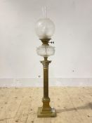 An Edwardian brass oil lamp in the form of a Corinthian column with etched glass shade, converted