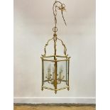 A lacquered brass hexagonal hanging lantern, with inset glass panels H90cm