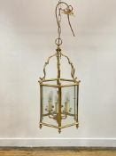 A lacquered brass hexagonal hanging lantern, with inset glass panels H90cm