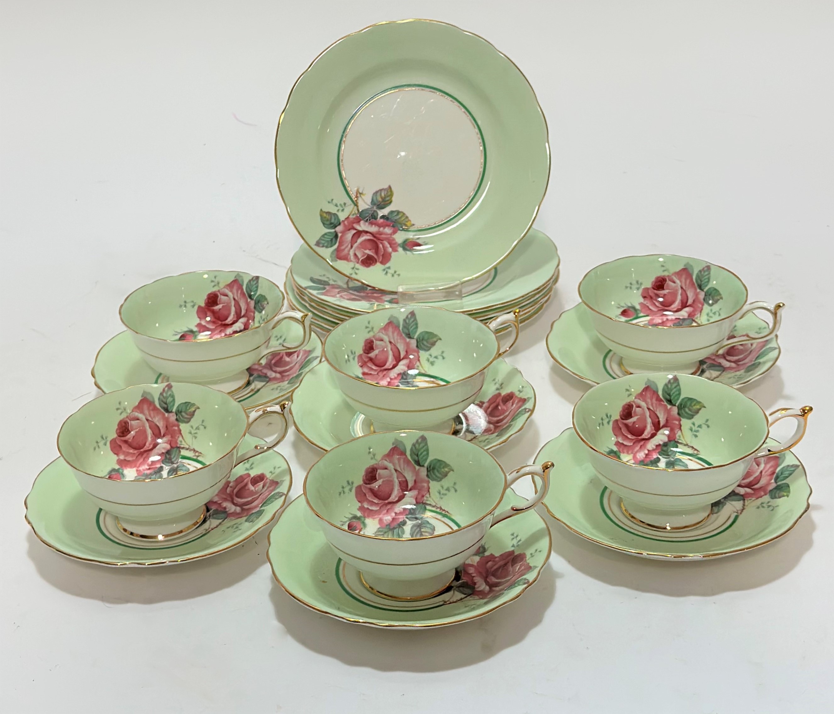 A Paragon fine bone china part tea service, comprising of six tea cups, six saucers and six side
