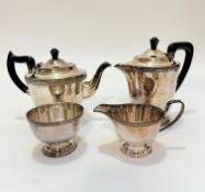 A four piece Epns tea and coffee service with Celtic style knot border and black bakelite knots