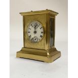 A German brass and glass carriage clock with musical alarm, circa 1890, probably Junghans,