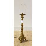 A Roccoco style cast brass lamp, on a triform base with paw feet, H60cm (Excluding bulb holder)