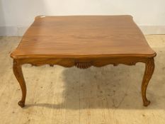 A French style walnut serpentine low table raised on cabriole supports, H47cm, 108cm x 108cm