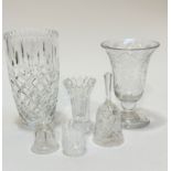 A crystal bell shaped vase with engraved floral sprays, raised on knop stem and circular base with