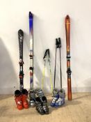 Three pairs of skis, two pairs of ski poles and a quantity of ski boots