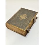 A Victorian tooled leather and brass mounted Holy Bible, Old and New Testaments, by William