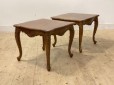 A pair of French style walnut low tables, serpentine tops over cabriole supports, H53cm, 64cm x