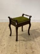 An early 20th century stained walnut piano stool with upholstered hinged seat H61cm, W58cm