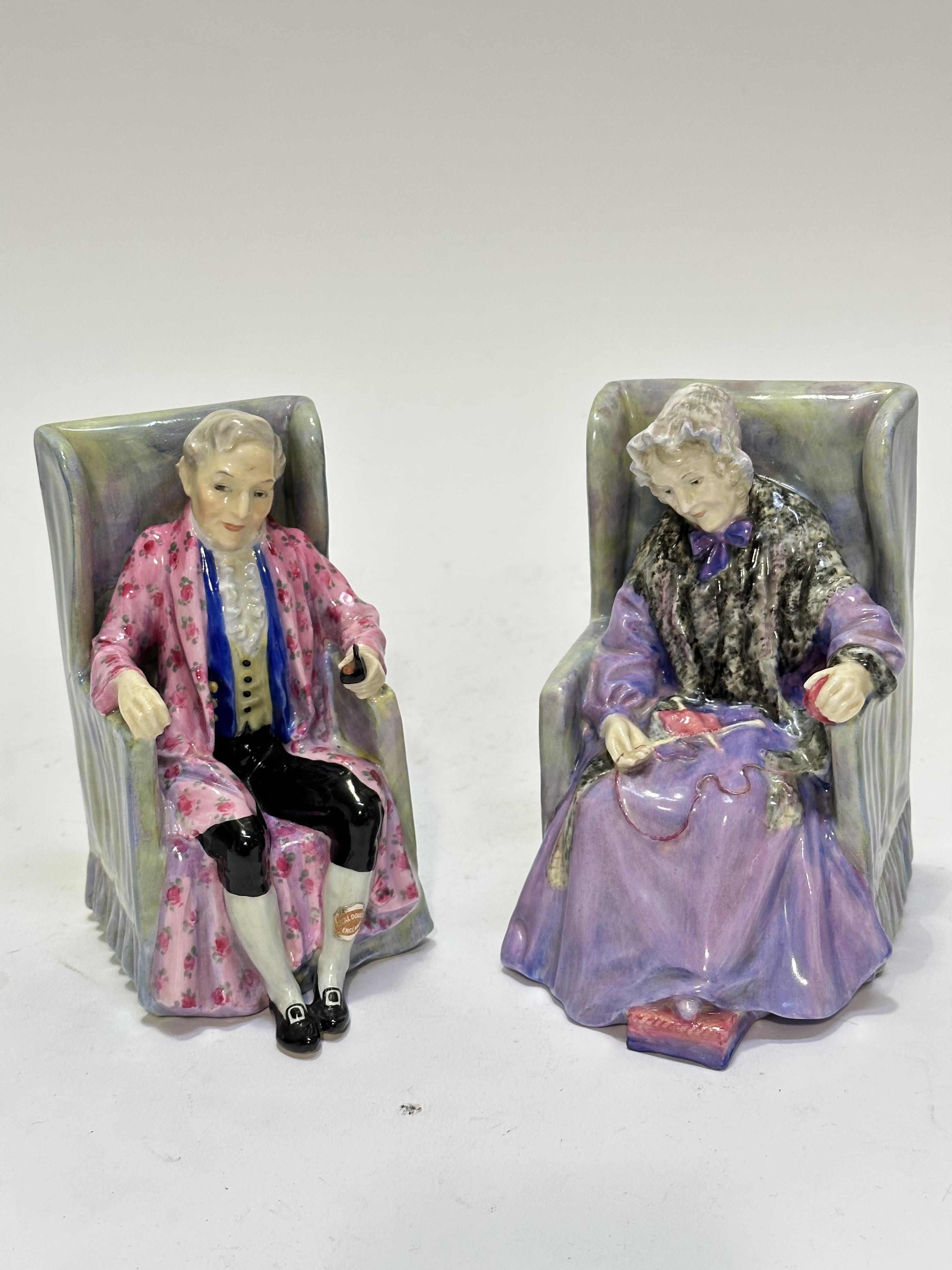 A pair of Royal Doulton figures, Derby and Jones, with original Royal Doulton gilt labels,