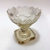 A large crystal slice cut serrated rim bowl on faceted and baluster stem, on octagonal base with