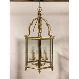 A lacquered brass six branch hall lantern of hexagonal outline, H65cm (Excluding chain)