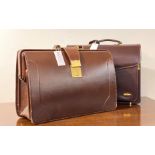 A Pierre Cardin leather brief case with two number combination lock (combination 02) together with a