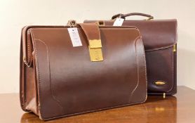 A Pierre Cardin leather brief case with two number combination lock (combination 02) together with a