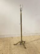 An Edwardian brass telescoping standard light, on triple splay supports
