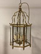 A lacquered brass six branch hall lantern of hexagonal outline, H65cm (Excluding chain)
