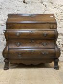 A late 18th century oak Dutch bombe bureau, fall front revealing interior fitted in typical fashion,