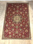 A Persian Zielger type rug, hand knotted, the red ground with interlaced foliate and chrysanthemum