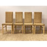 A set of four contemporary dining chairs, woven string seat and back raised on square tapered