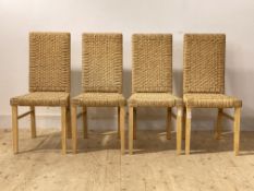 A set of four contemporary dining chairs, woven string seat and back raised on square tapered