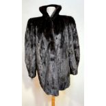 A lady's NLG British Made mink jacket by London label, with satinised lining, slash pockets to side,