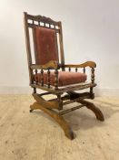 An early 20th century walnut framed American style rocking chair, H110cm, W57cm, D76cm