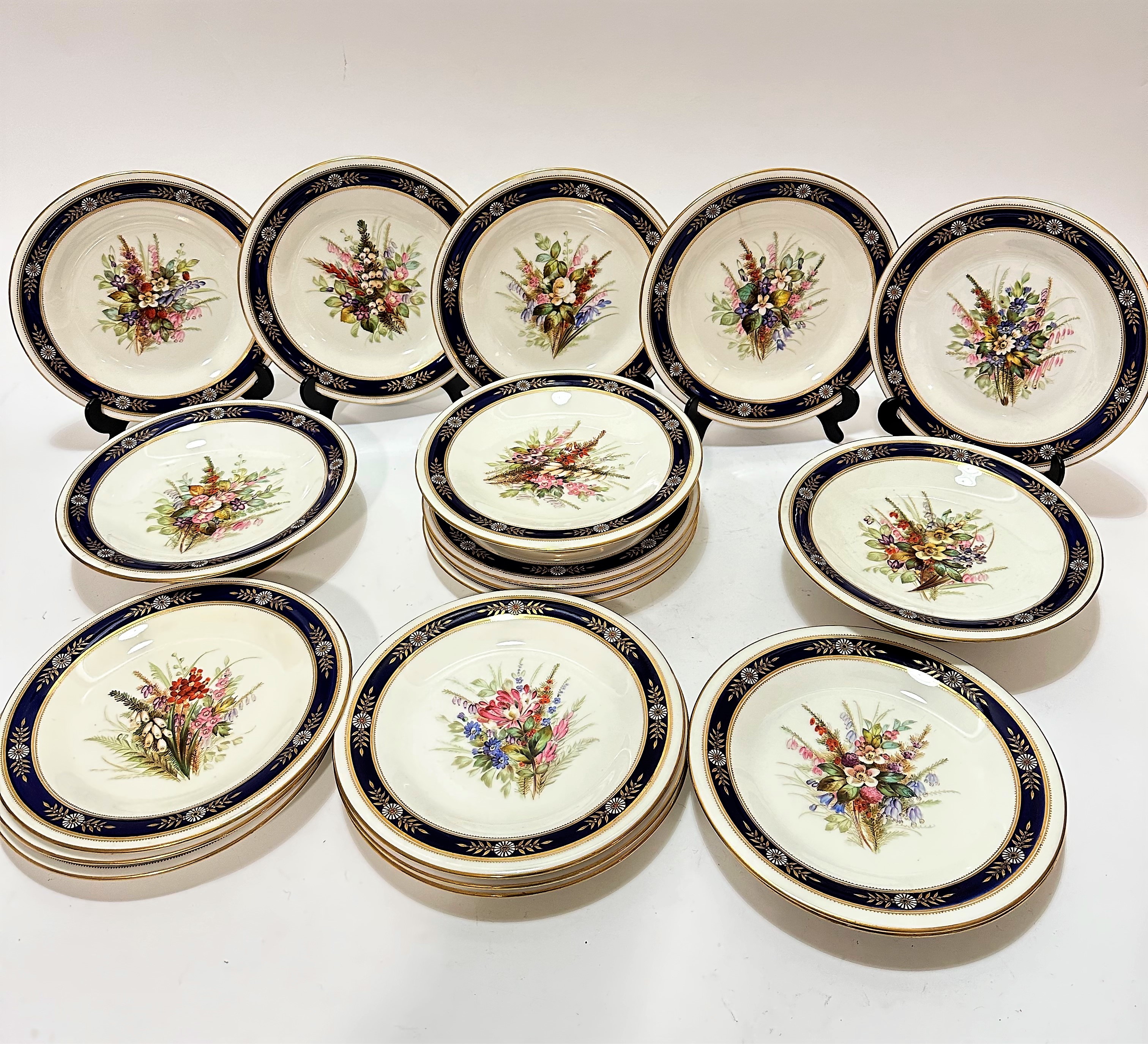 An Edwardian Royal Worcester nineteen piece dessert service including three stands, (5cm x 23cm) and
