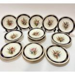 An Edwardian Royal Worcester nineteen piece dessert service including three stands, (5cm x 23cm) and