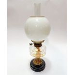 An Edwardian brass Hinks Triple No.1 mounted vitrolite based oil lamp with faceted glass reserve,