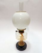 An Edwardian brass Hinks Triple No.1 mounted vitrolite based oil lamp with faceted glass reserve,