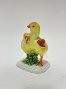 A Herend Hungarian porcelain figure group of two young chicks decorated with polychrome enamels, (