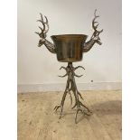 A large white metal free standing ice bucket with twin stylised stag head handles and antler