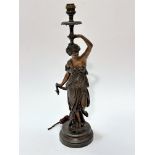 A French cast spelter figure lamp of a young lady draped in Grecian style, on circular moulded base,