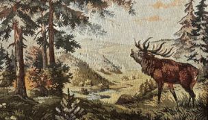 A machine made tapestry depicting a stag braying in Highland scene, moulded oak coloured frame, (