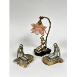 A pair of Art Deco silvered coated kneeling female figure bookends, mounted on alabaster bases and a